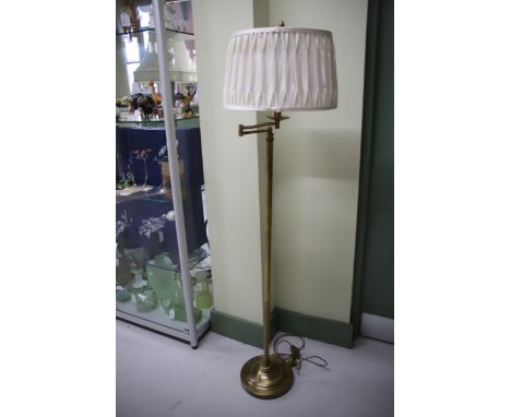Modern Standard lamp with articulated top and silk shade. Measures approx 61 inches see photos. 