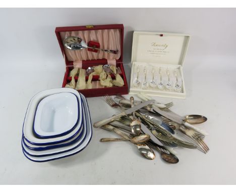 Vintage enamel dishes and  a selection of cutlery.