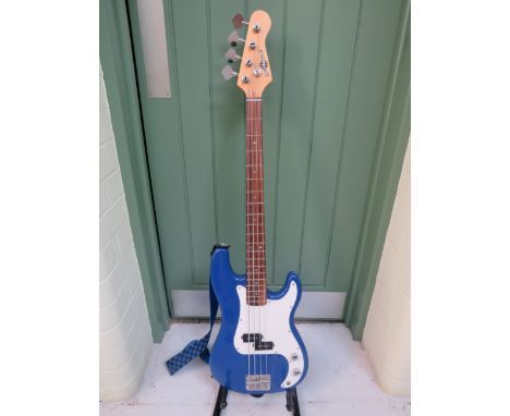 Lovely Bass Guitar in vivid Blue body , in very good condition comes with carry strap.  See photos.