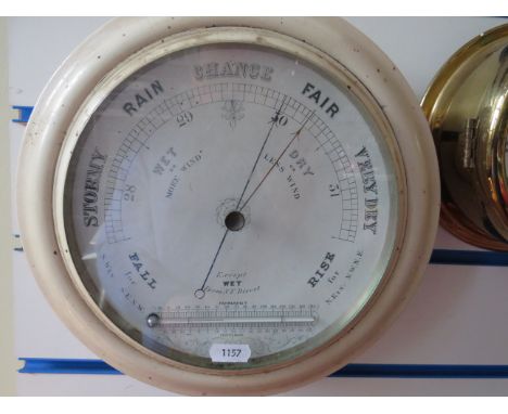 Circular Barometer/Thermometer in working order together with a reproduction ships clock with quartz movement. See photos.