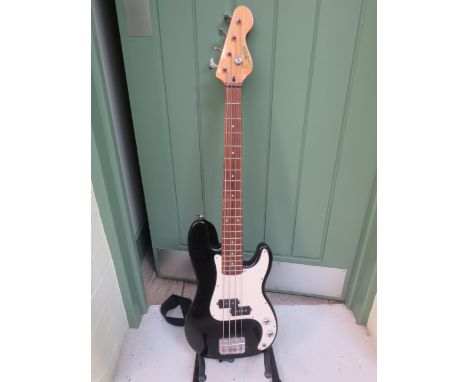 Encore Solid Body Bass Guitar in good condition. Comes with carry strap.  See photos. 