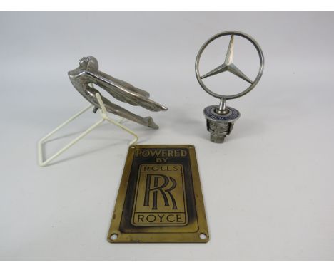 Mercedes benz hood mascot, vintage chrome winged goddess hood ornament and a Rolls royce plaque.