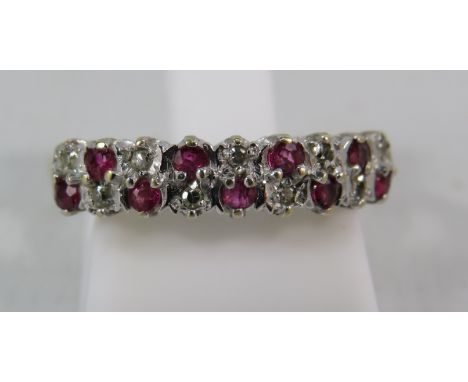 9ct gold diamond and ruby half eternity ring, finger size "N". 1.7 grams