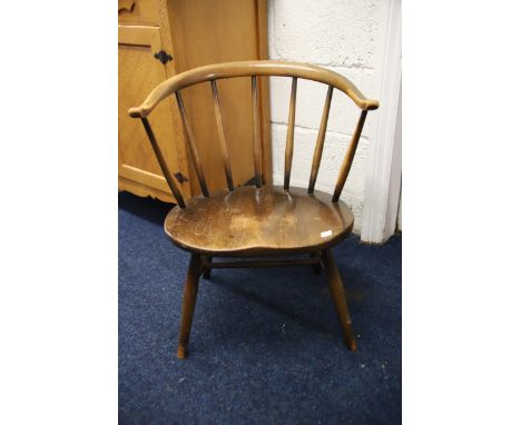 Ercol Blue Lable Cowhorn chair in Golden Dawn Colourway, In solid condition but would benefit from light restoration. . See p