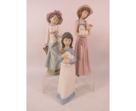 Three Nao figurines of Girls with animals, the tallest measures 9.5".