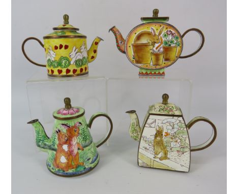 Four Trade Aid enamel Kettles decorated with rabbits.