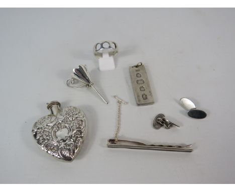 Mixed lot of Sterling silver items including Ingot, perfume pendant, funnel, cufflink and tie clip. 72. grams