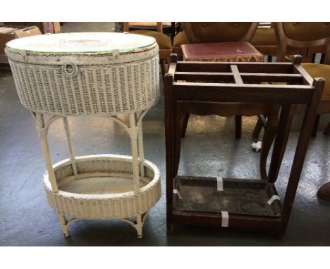 An Oak umbrella/stick stand with metal drip tray, and a painted Lloyd Loom sewing basket with undershelf, 75cmH