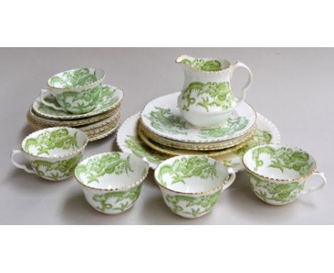 A Crown Staffordshire 'Green Dragon' part tea set, highlighted in gilt, consisting of 8 saucers, 5 cups, 4 side plates, a mil