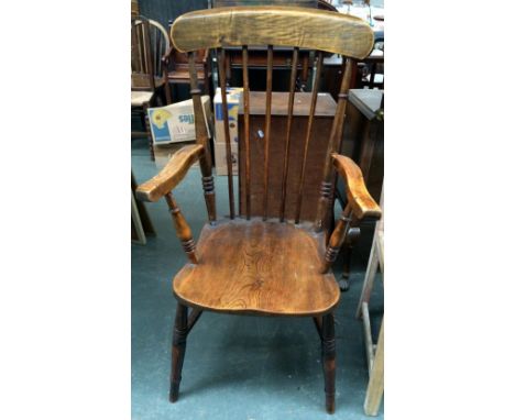 An elm stick back open arm chair on turned legs