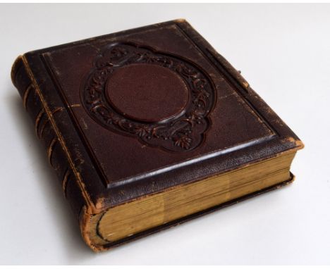 A late 19th century photo album from the Fozard family, with tooled leather binding, containing several letters, many portrai