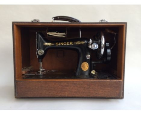 A 1938 Singer Sewing machine in box, with original manual, machine class 99K, serial number EB861939