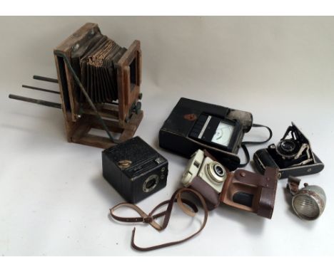 A Coronet box camera, Ilford Sporti 4 35mm camera in case, a Compur bellows camera, a Kuwmeg 500 insulation tester with voltm
