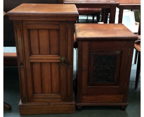 Two mahogany bedside cabinets each with single cupboard, the one with carved front panel of vase and floral display with hand