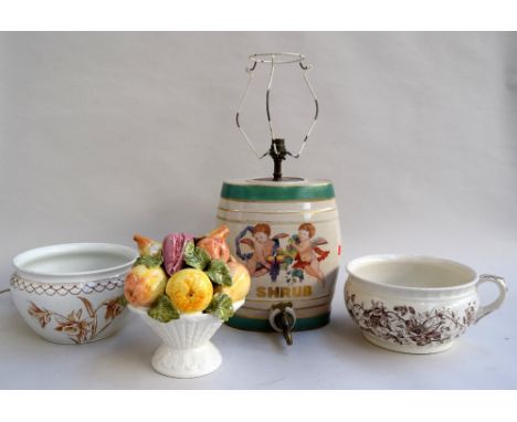 A ceramic bowl of fruit, two chamber pots and a 'SHRUB' sherry barrel and tap converted