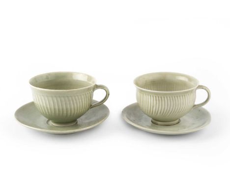 David Leach (1911-2005)Two cups and saucersceladon glazeimpressed potter's sealssaucers 15cm diameter. Provenance:The Daphne 