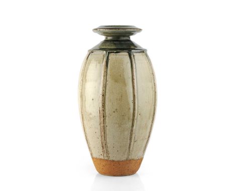 Richard Batterham (1936-2020)Vaseash glaze, the body with raised bands, the neck with green ash glaze38cm high.Small pits and