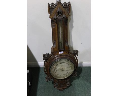 Victorian oak barometer, with a mercury thermometer and silvered dial, 85cm high