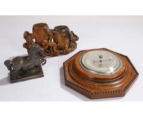 Oak cased barometer with silver coloured dial, soapstone carving depicting a monkey and birds beside two gourds, pewter figur