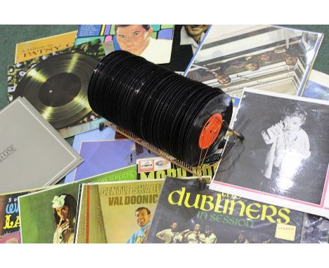 LP's and 45's to include Status Quo, Shirley Bassey, the Rolling Stones etc. (qty)