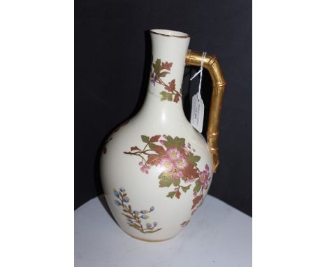 Royal Worcester vase, painted with flowers and a gilt branch effect handle, 27cm high