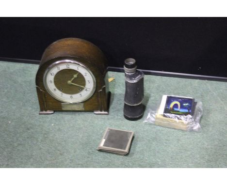 Oak mantel clock, together with a monocular and a collection of magic lantern slides