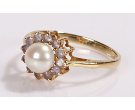 9 carat gold pearl set ring, the central pearl with a violet stone surround, ring size P 1/2, 1.9 grams