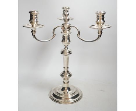 An Elizabeth II silver three branch, three light candelabrum, by William Comyns &amp; Sons Ltd, London, 1965, height 34cm, we