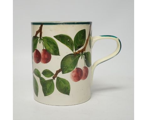 A Wemyss mug with cherry decoration (restored a.f.), 14cm high