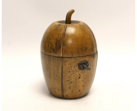 A fruitwood ‘melon’ tea caddy, in Georgian style, 15cm high Artificially-distressed surface; the key locks but the lock itsel