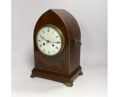 A late 19th century mahogany lancet shaped mantel clock, striking on a coiled gong, 29cm high Case good; dial light hairline 