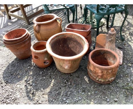 Ten assorted garden pots and planters, largest diameter 40cm, height 31cm together with a decorative ridge tile