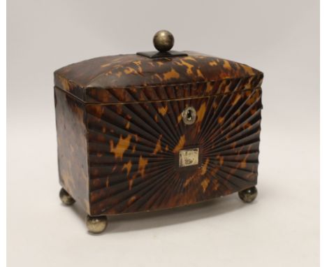A Regency tortoiseshell tea caddy, with fluted paterae bowfront, 17cm high, 18cm wide, 10cm deepTop-right corner of frontage 