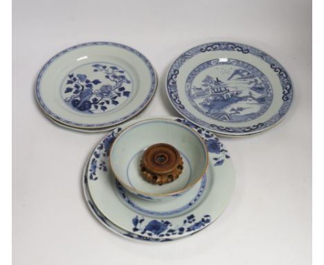 Six Chinese blue and white plates, 18th century and a Kangxi blue and white bowl and wood stand