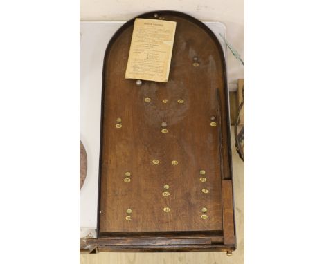 A bagatelle board with balls and instructions