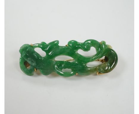 A Chinese 18k mounted carved jade brooch, 50mm, gross weight 9.1 grams.