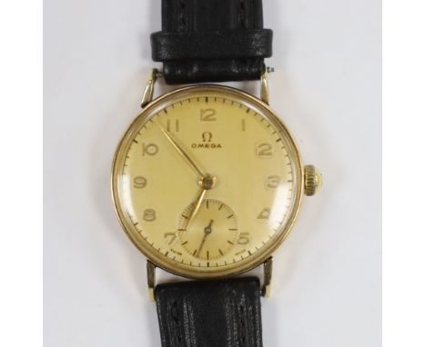 A gentleman's mid 1940's 14ct gold Omega manual wind wrist watch, movement c.26.5.T3, case diameter 31mm, on later associated