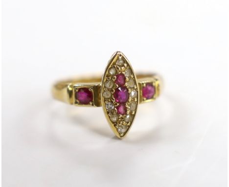 A late Victorian 18ct gold, ruby and diamond cluster set navette shaped ring, size J, gross weight 2.4 grams.