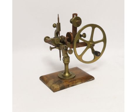 An early 20th century watchmaker's topping tool, for adapting the profile of teeth on watch wheels, 23cm high