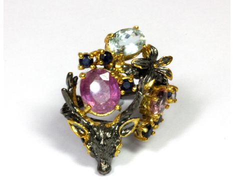 A Hana Maae silver gilt deer head shaped ring set with rubies, sapphires, aquamarine and kunzite (O.5).