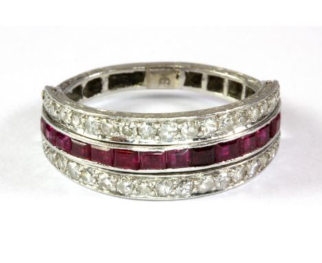 An Art Deco style platinum (stamped 950) diamond and ruby metamorphic ring (R).