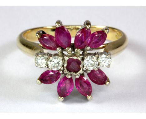 A 14ct yellow gold (stamped 14k) ruby and diamond set ring (Q).