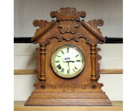 A 19th century oak mantle clock, H. 41cm, understood to be in working order.