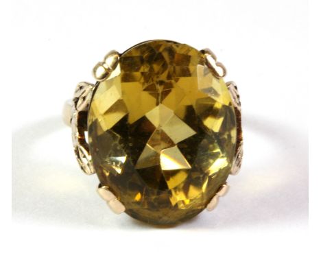 A 9ct yellow gold and large citrine set ring (J).