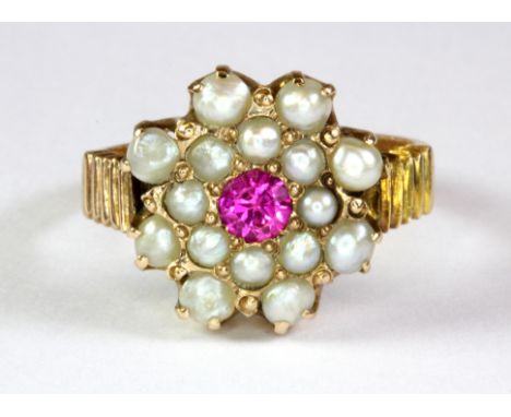 A Victorian yellow metal (tested 14ct gold) ruby and seed pearl set cluster ring (L).