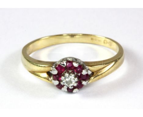 A 9ct yellow gold (worn hallmark) ruby and diamond cluster ring (M.5).