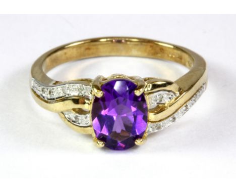 A 9ct yellow gold amethyst and diamond set ring (N.5).