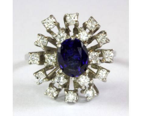 An 18ct white gold (stamped 18ct) sapphire and diamond set ring (L.5).