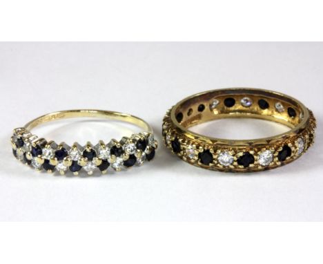 A 9ct yellow gold sapphire and white stone full eternity ring (R) (one stone missing), together with a 9ct yellow gold sapphi