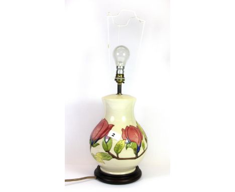 A large Moorcroft Hibiscus pattern lamp base, H. 52cm (including shade frame).